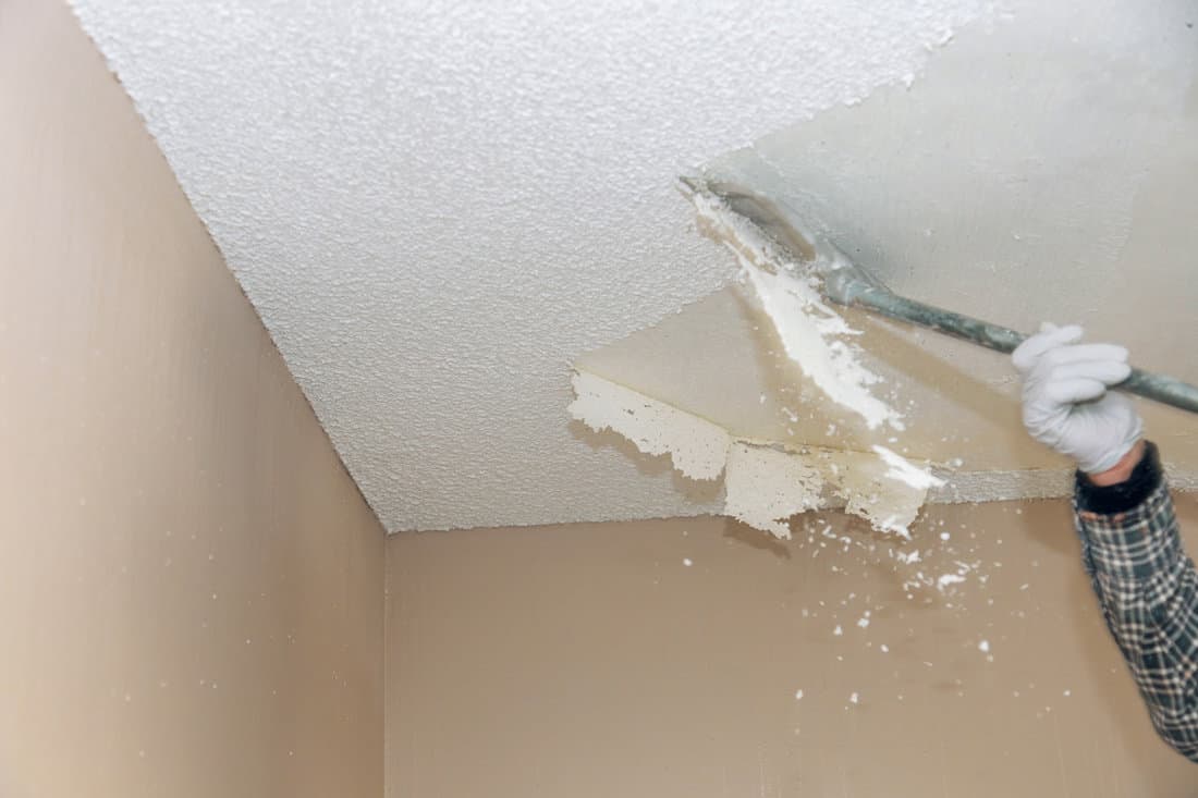 Removal old dirty popcorn ceiling wall background