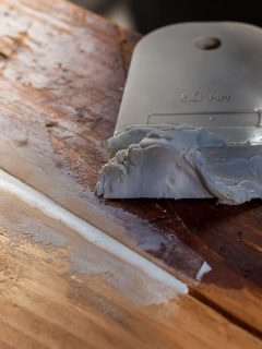 Sealing cracks in old garden table with acrylic putty, Can Wood Filler Hold Weight? [And How Much]