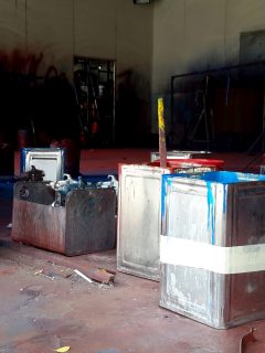 The thinner bucket and paint bucket wait for operate in the spray booth - How Long Does Paint Thinner Smell Last