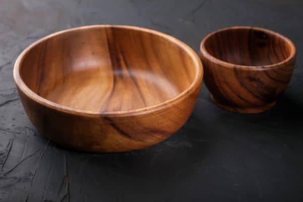 Two wooden bowls on the table, How To Remove Scratches From Nambe Items