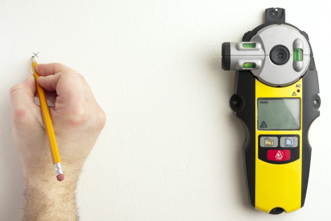 Using a laser level and stud finder.See related