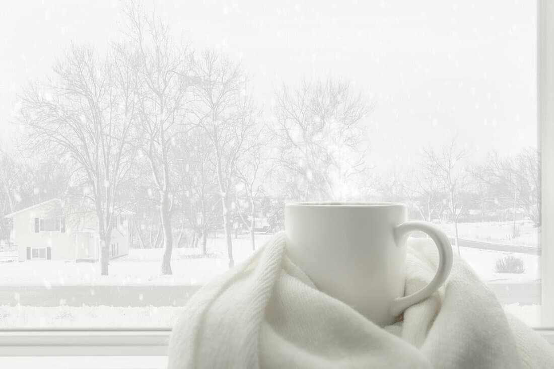 White winter concept of hot drink and winter accesseries