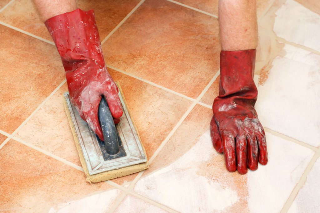 Wipe the tiles with a finishing grout