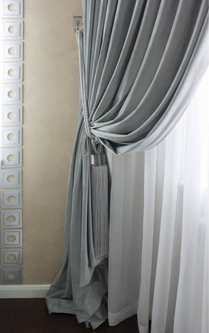 a fabric drapery with tassel