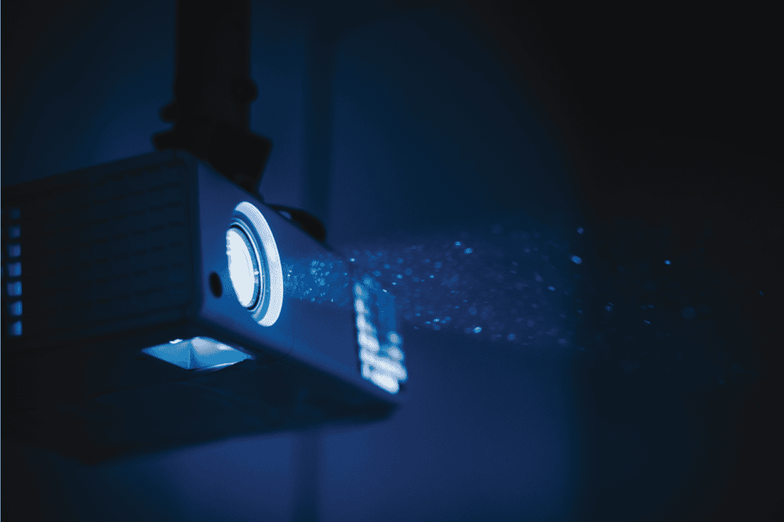 bright operating projector inside a dark room