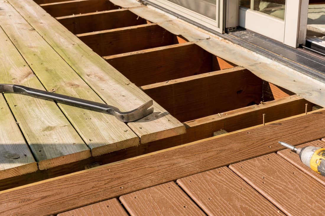 repair, replacement of wood deck on the patio, old wood to new wooden deck
