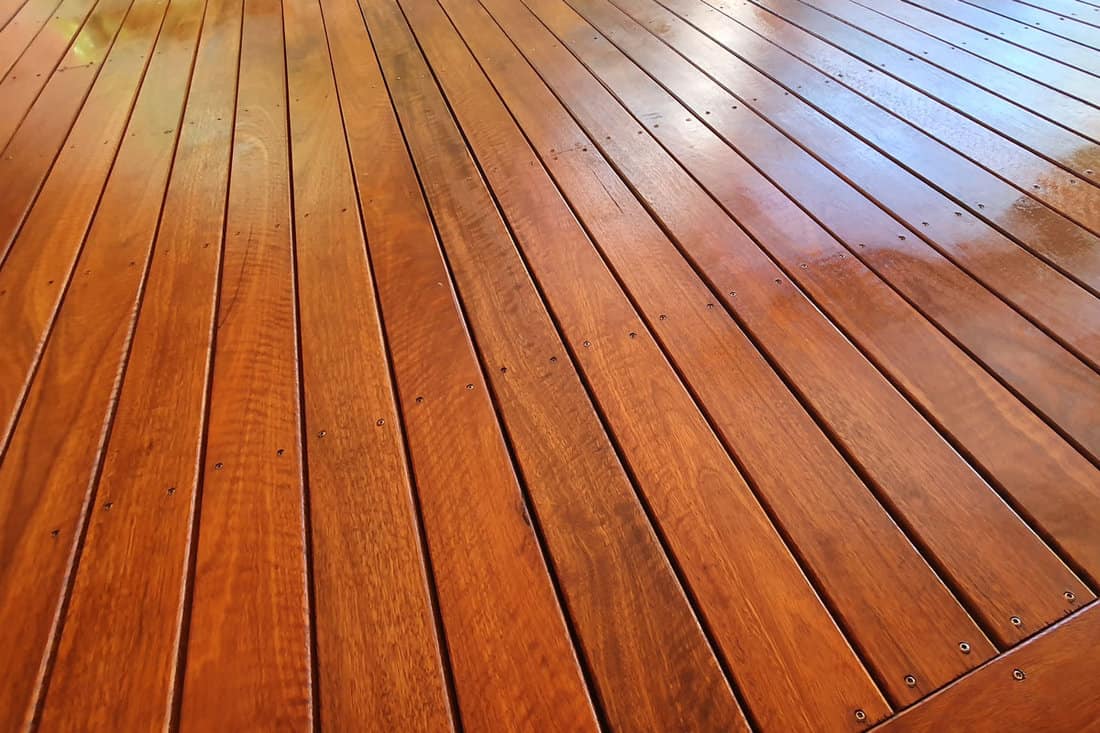 shiny wood deck floor, brown colored wood, wood stain, indoor wood floor deck, hard wood