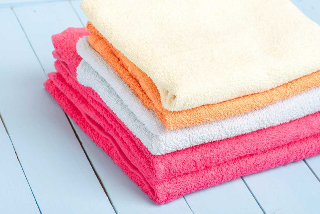 Cotton, textile towel. Hygiene dry bath cloth. Clean, soft, fabric, fluffy bathroom washcloth.
