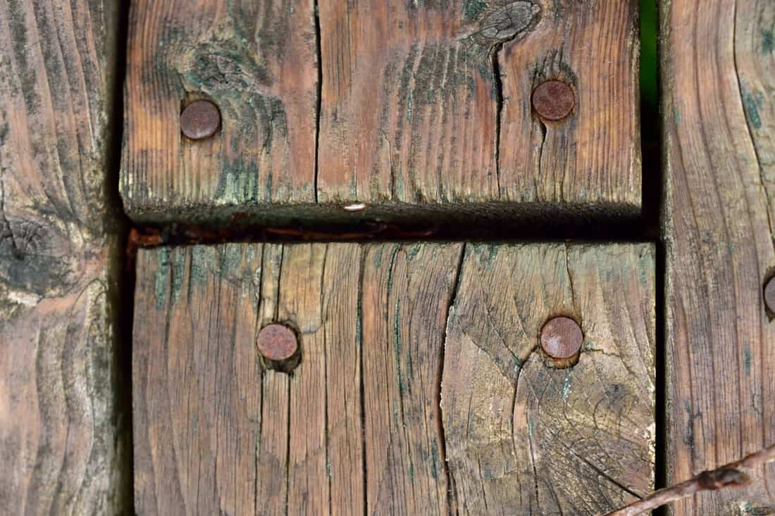 splitted wood deck on the house, old wood, old nails, rust