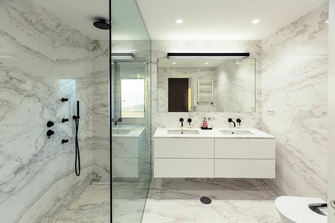 very clean looking white modern elegant bathroom of the hotel room