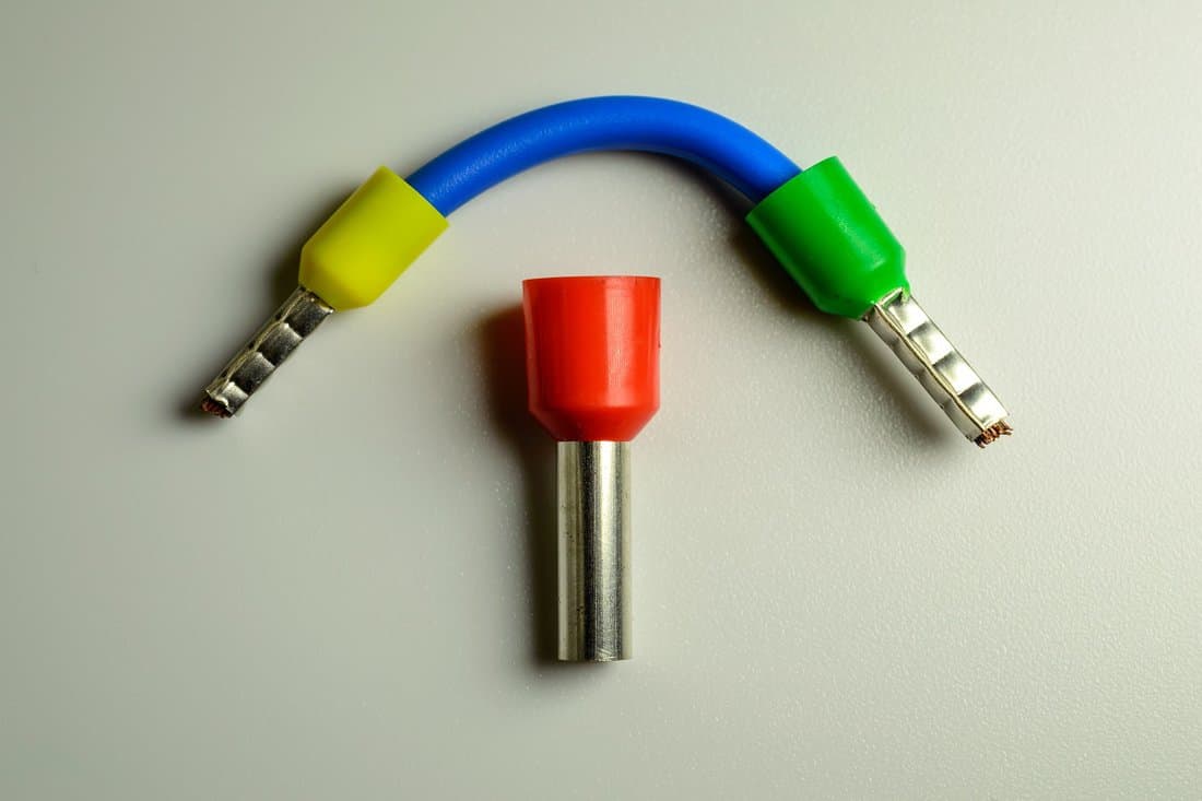 What Is A Ferrule? How Do You Use Them? - Blue cable with yellow and green ferrules and big red ferrule in the middle of composition.