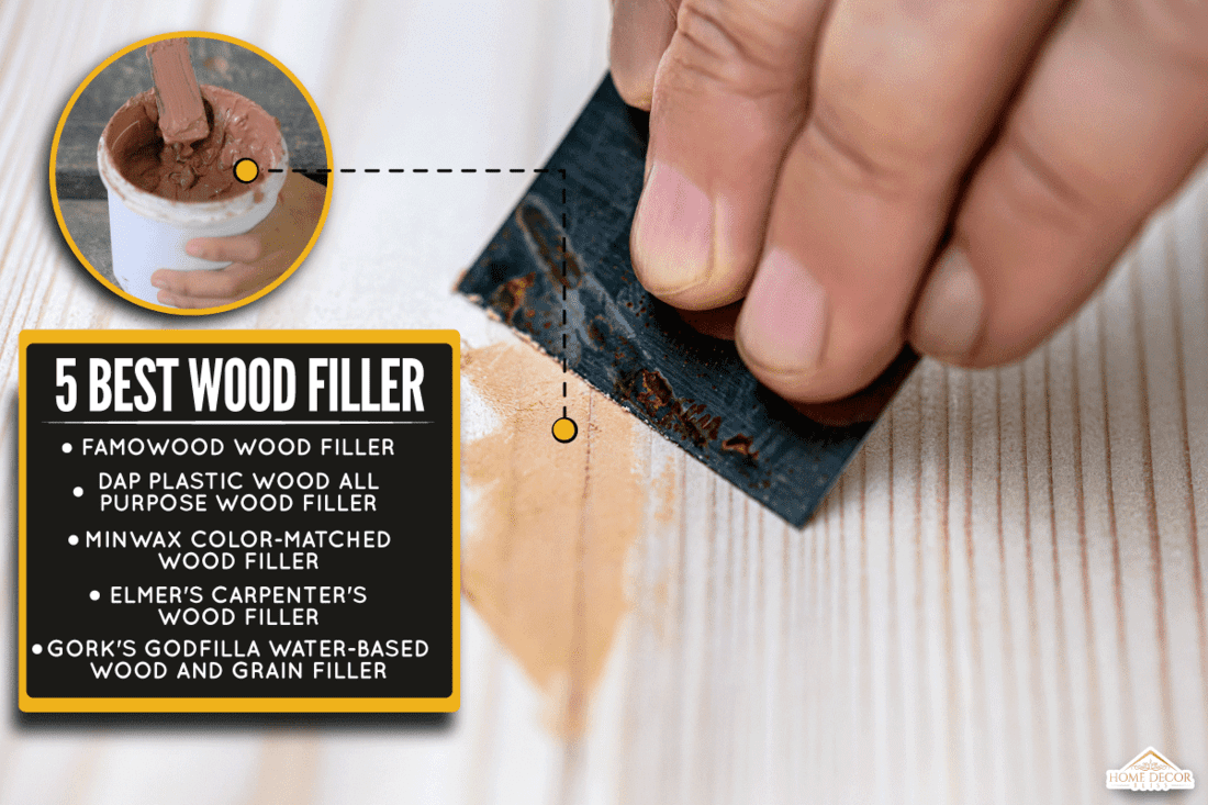 Wood filler brown color with a hand scraping it in the white wood, 5 Best Wood Fillers For Trim [Inc. White Trim]