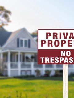 A sign warning private property and no trespassing in front of a luxury home. A cautionary signage - How Far Apart Should No Trespassing Signs Be