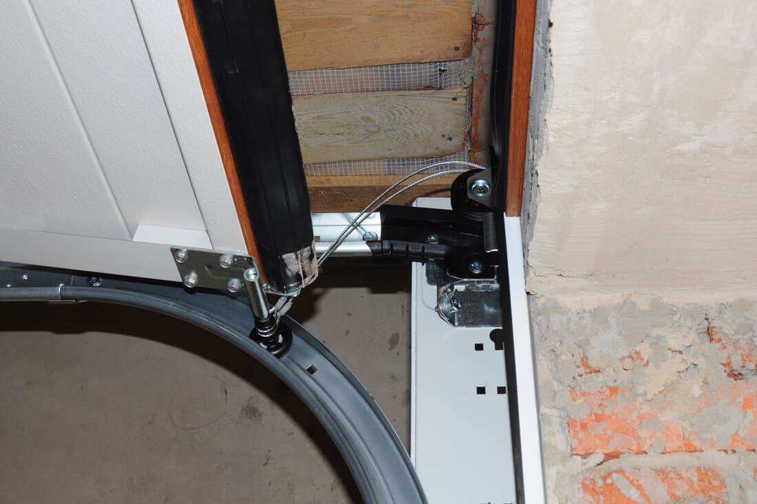 Contractor repair and install garage door. Replace a Broken Garage Door Spring. Garage Door Spring Repair and Replacement.