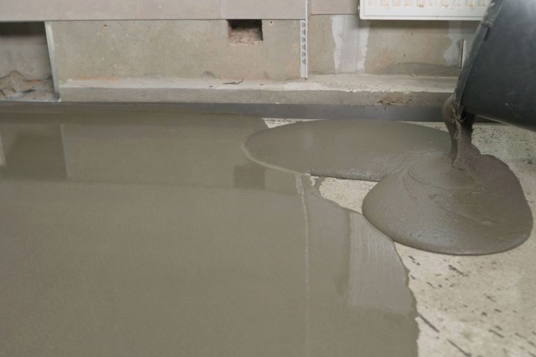Leveled dry cement-sand mixture on the floor surface in a building under construction, How To Raise A Floor: Everything You Need To Know!