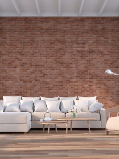 Modern contemporary living room with empty red brick wall