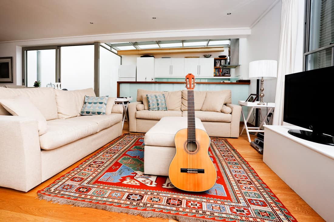 Modern living room interior with classic acoustic guitar