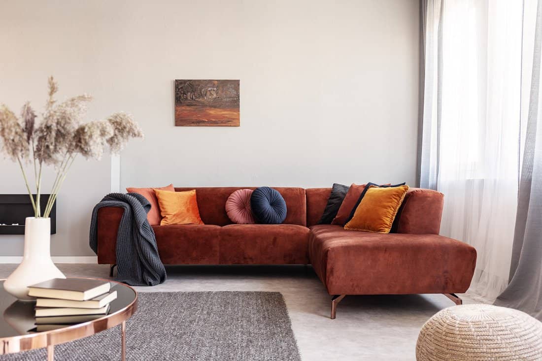 Orange - Real photo of warm color cushions on a red couch