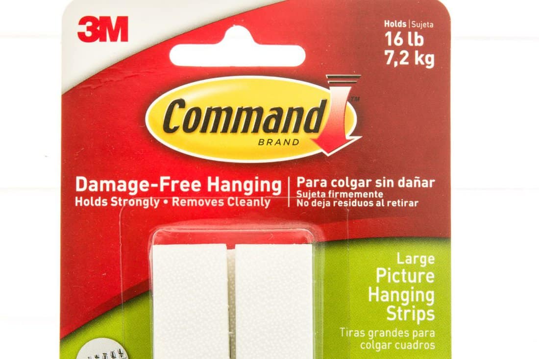 Package of 3M command brand hanging strips on an isolated background.