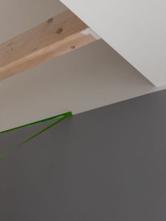 Painter removes masking tape and creates a sharp border between a grey and white painted part of a, Drywall Tape Is Falling Off My Garage Ceiling - Why And How To Fix It?