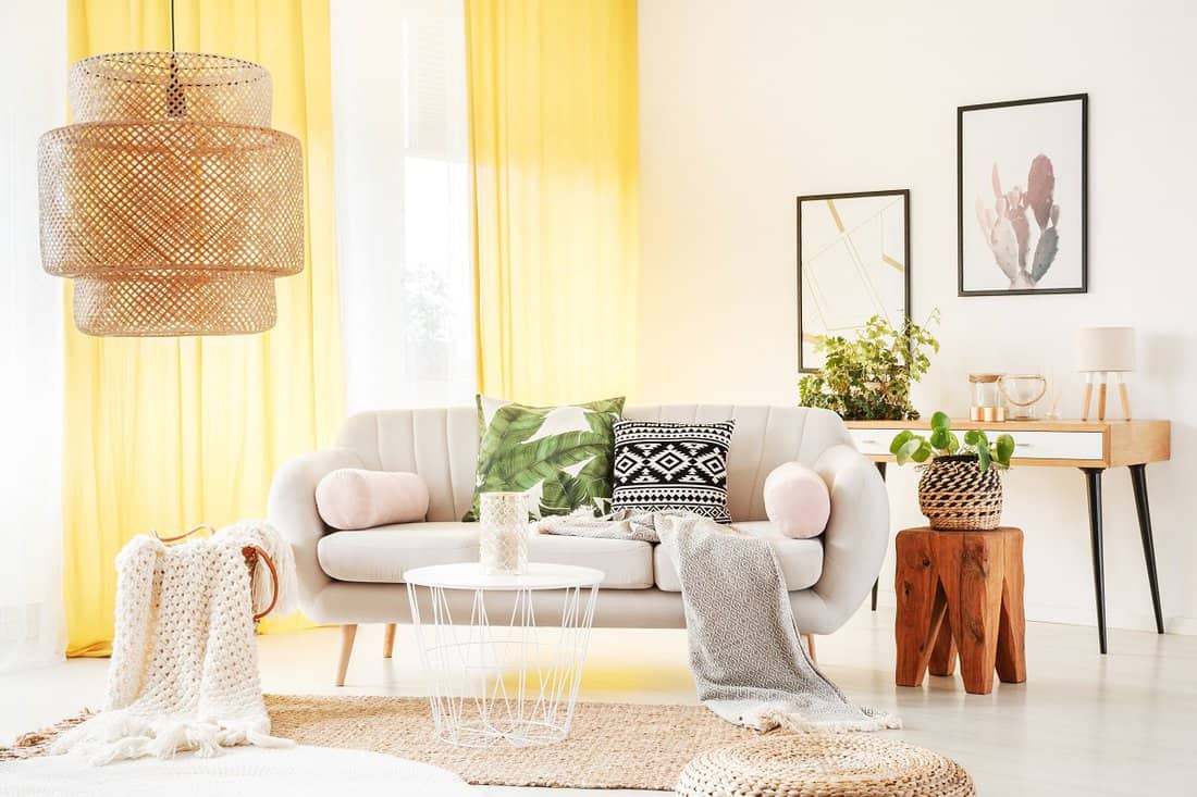 Pastel Yellow - Bright yellow curtains hanging in a stylish boho room