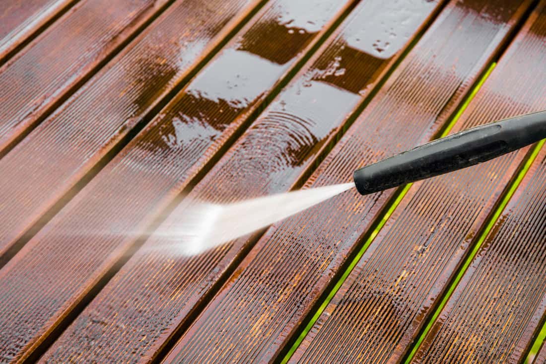 Power spraying a wooden deck