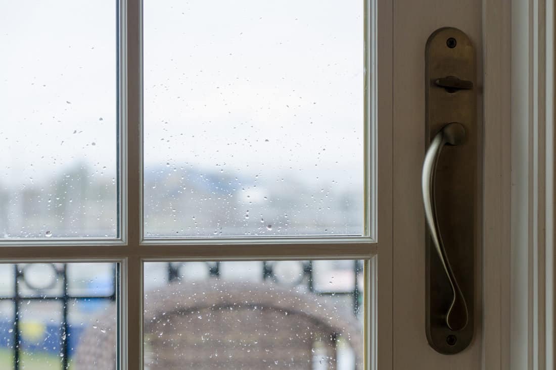 Rain drops on french door facing marina at Drayton harbor, Blaine, Washington