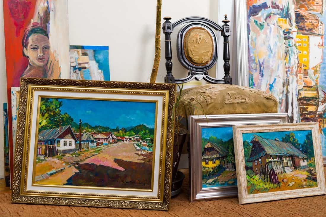 Showcase your art collection - Collection of different types of handmade framed paintings in the workshop.