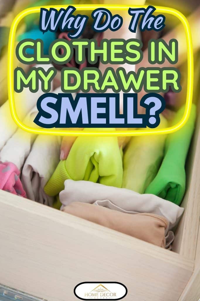 The woman folds t-shirts in the drawer. A woman is tidying up the closet. Vertical storage of clothing.