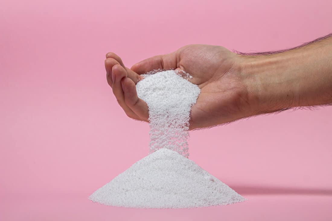  Washing powder pouring out of a man's hand