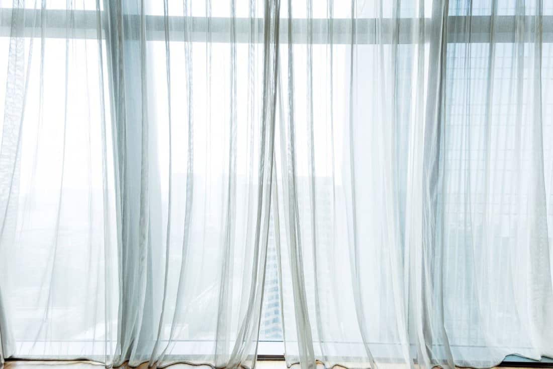 White curtain hanging in the window