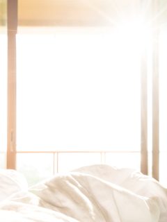 warm bed with sunshine from outside - Why Is My Room The Hottest In The House [And What Can I Do About It]