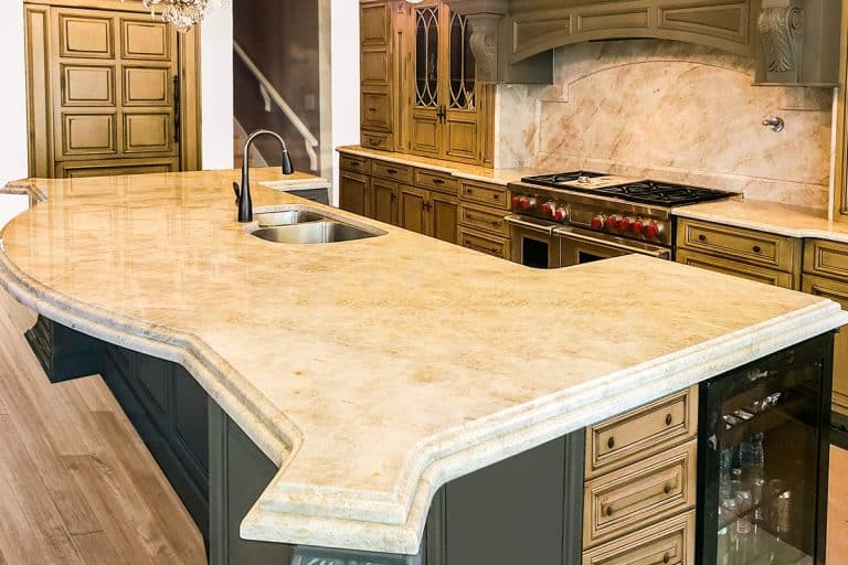 Beautiful kitchen in kuxury home with large island, What Is Sintered Stone [Including Pros, Cons, & Uses]