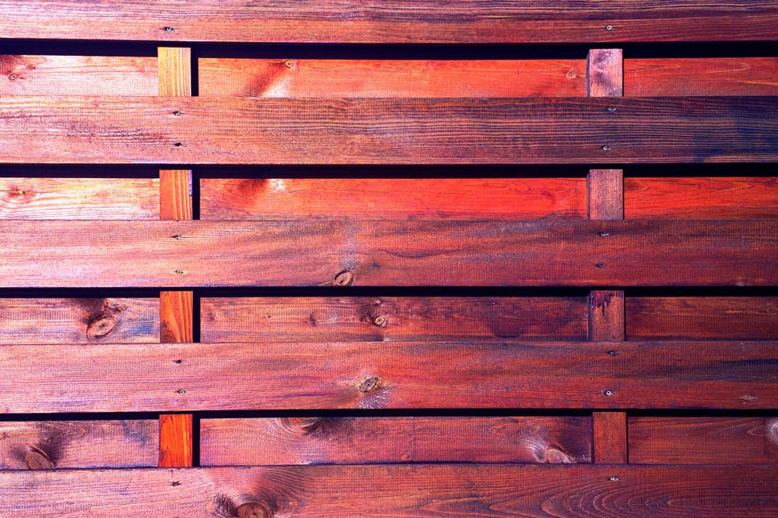 Board and board fence with varnished