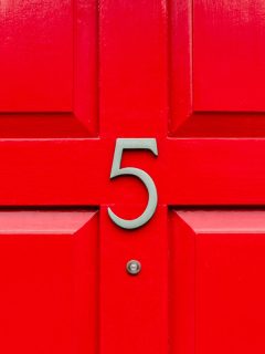 Bright red front door with the house number 5 and the five in elegant Silver metal with a peep hole den close up, How To Attach House Numbers Without Screws
