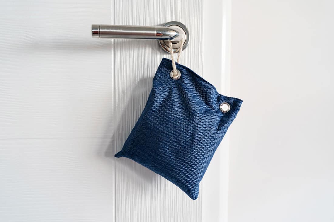 Charcoal bag hangged in a door