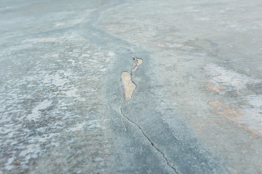 Close up of hairline crack and detail of expose concrete in perspective view