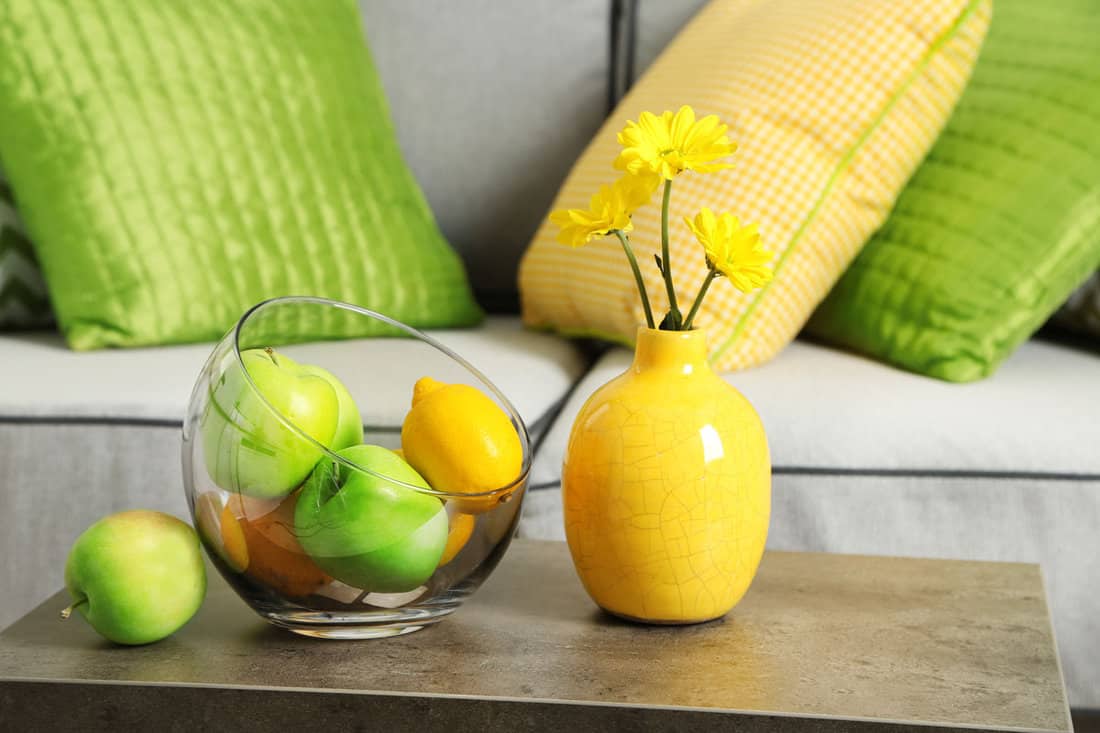Colorful pillows on sofa yellow and apple green