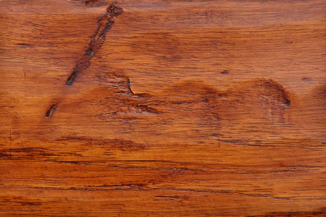 Damaged hickory flooring photographed in great detail