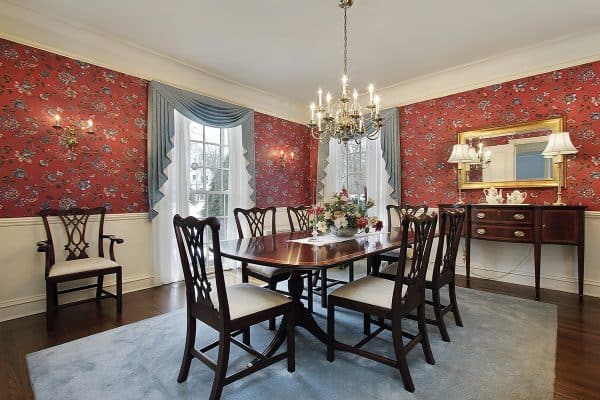 Dining room in luxury home with red floral wallpaper, How To Tone Down Busy Wallpaper