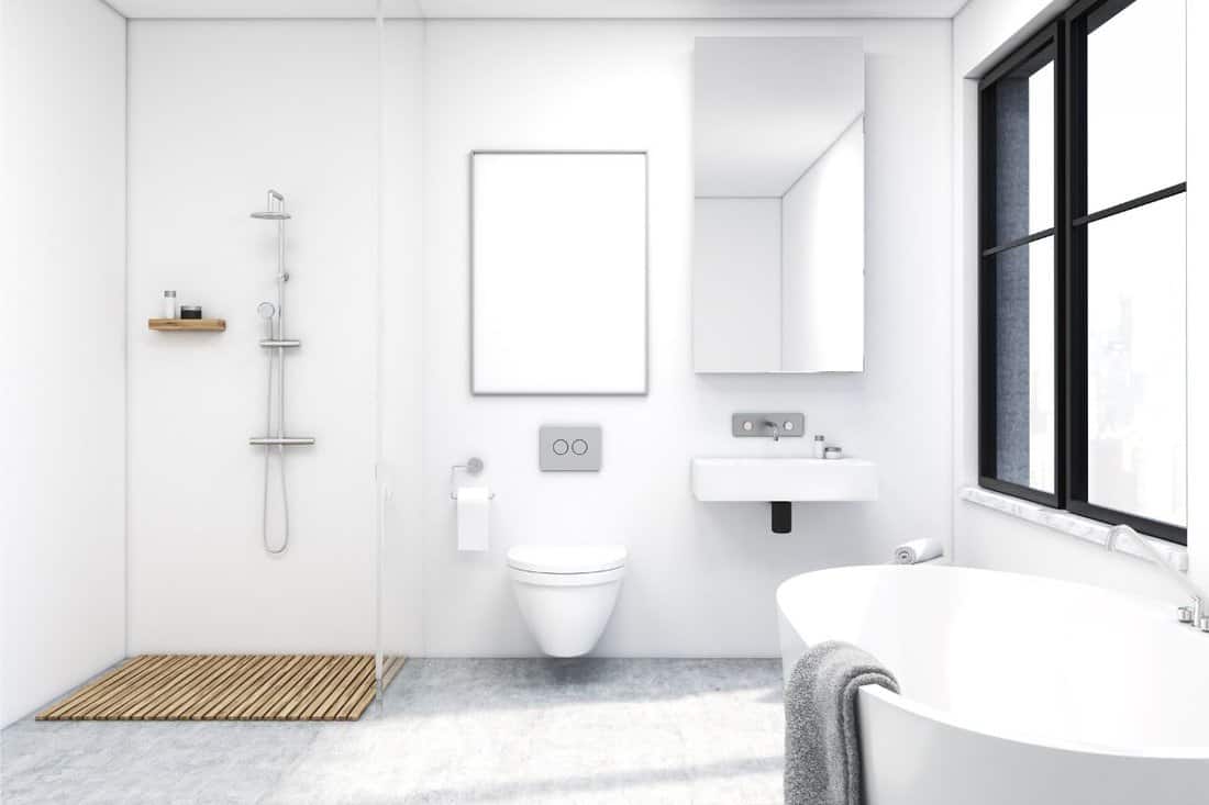 Front view of a bathroom interior with a shower, a toilet and a sink. There is a large window and a tall mirror on a wall. 3d rendering. Mock up.