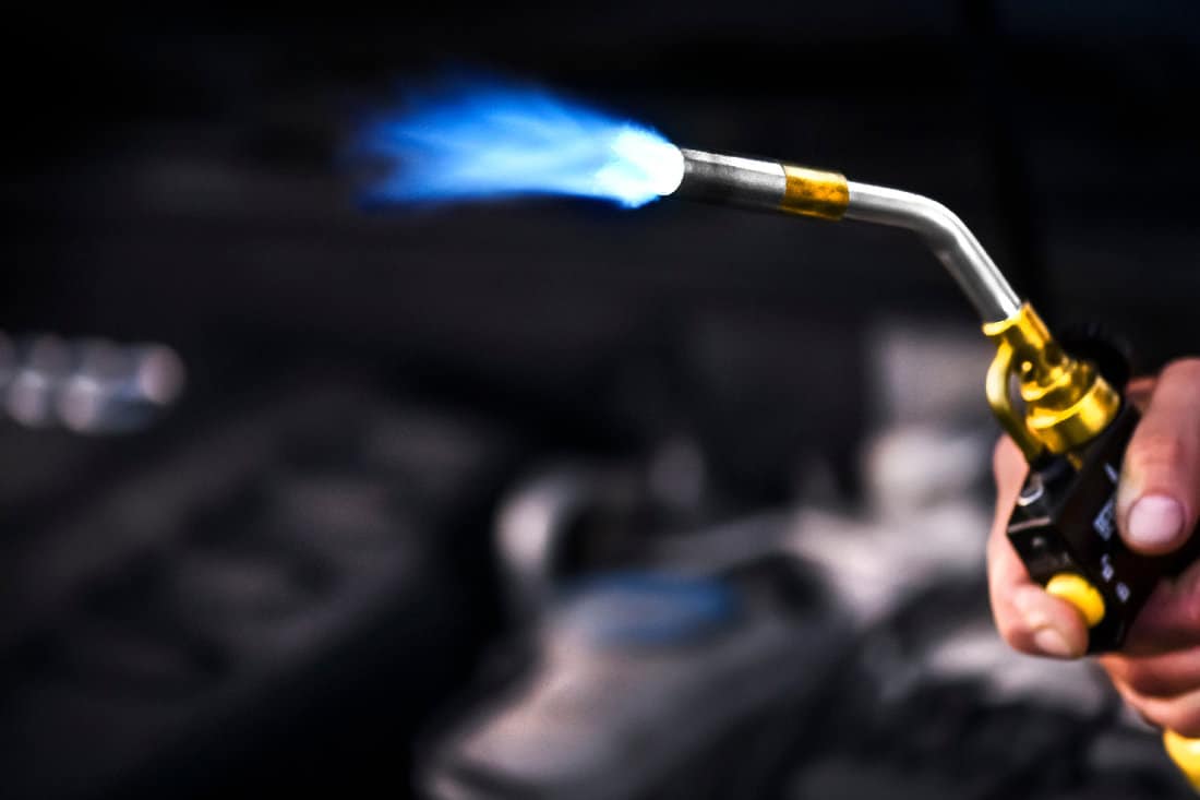 Gas torch burner in steel company