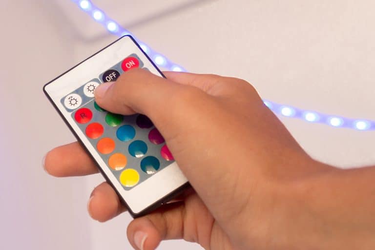 Hand holding a LED strip remote control, Lost Remote For LED Lights! How To Turn On/Off Or Change Colors Without It?