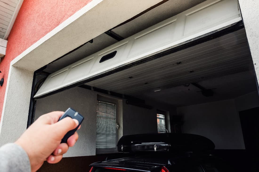 Hand use remote controller for closing and opening garage door