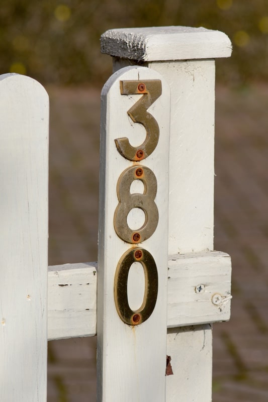 House number 380 sign on gate