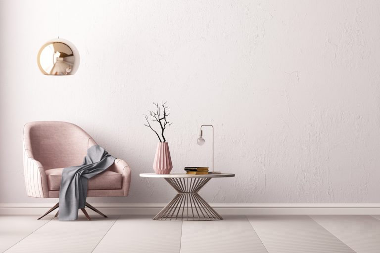 Interior with an armchair and a little table on a background of an empty wall, How To Make Rose Gold Color Paint [Which Colors To Combine & How Much?]