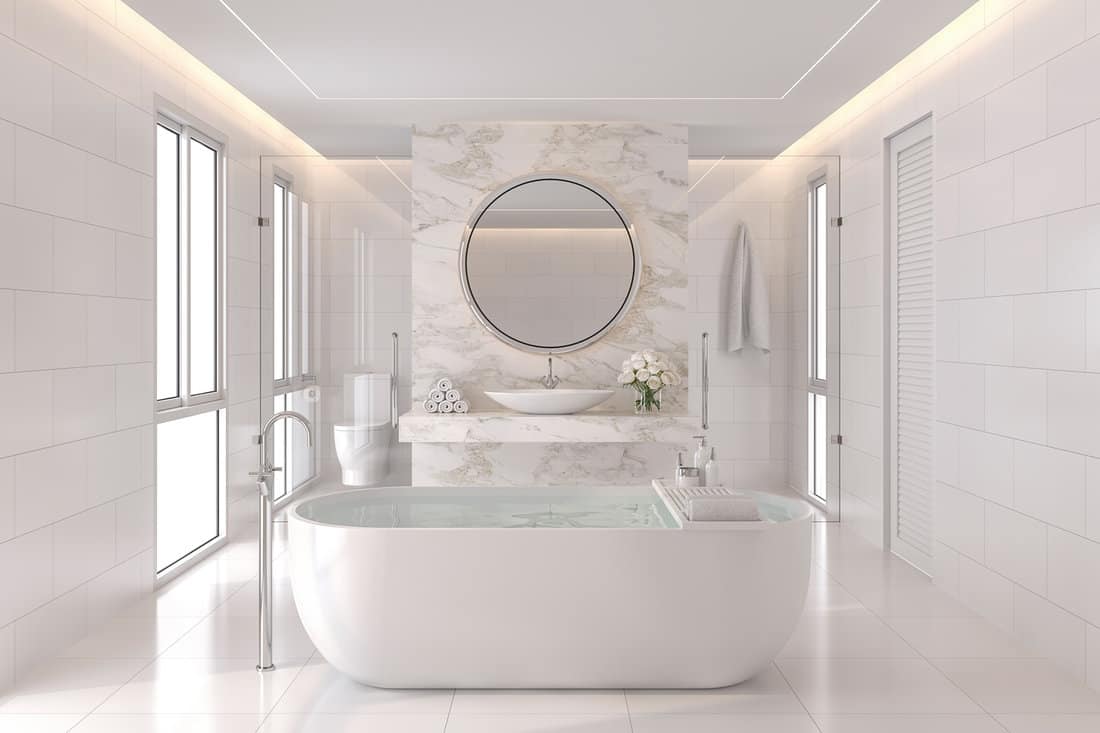 Luxurious white bathroom modern style render. The room has white tiles and the wall is decorated with marble at the back of the basin wall. There is a large window of natural light into the room