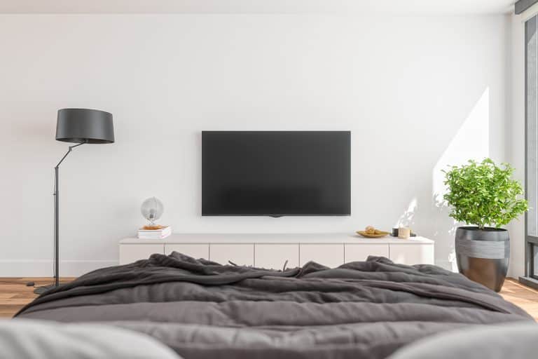 Modern bedroom with television and furniture in front of the bed, How To Decorate A Wall Opposite The Bed [10 Ideas To Inspire You!]