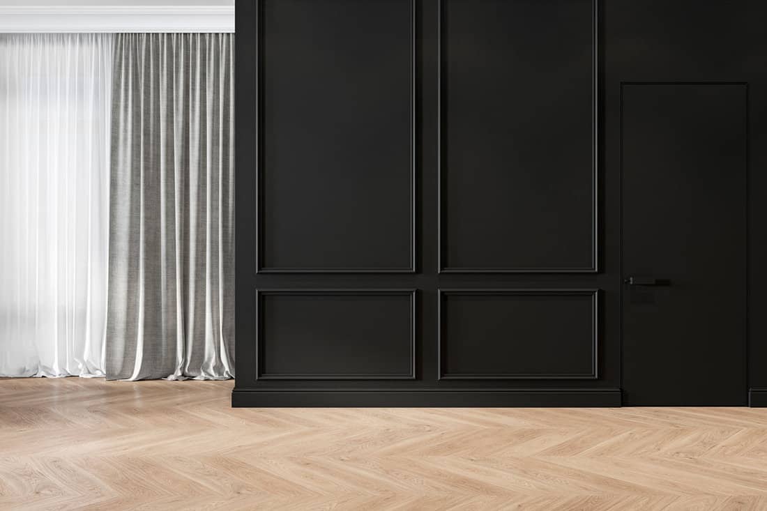 Modern classic black interior blank wall with moldings, curtains, hiden door and wood f