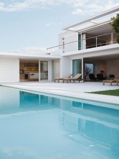 Modern house and swimming pool, Outdoor Pool Temp Vs Air Temp: Is The Water Warm Enough To Swim?
